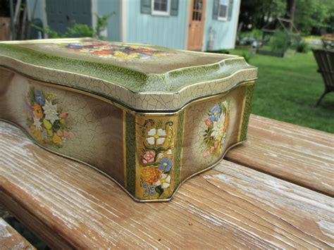 antique embossed metal cookie box|Vintage embossed metal box / blue flower hinged lid / Marked .